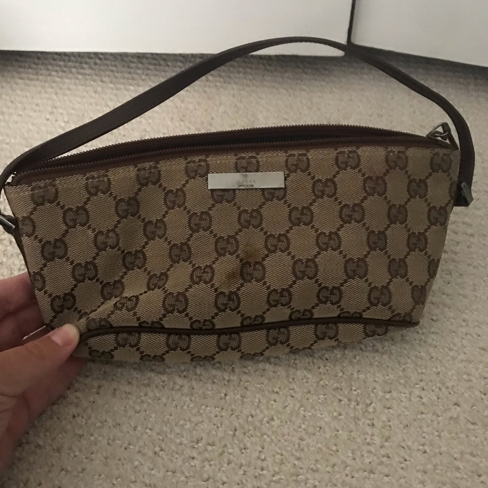 Small, brown/tan authentic Gucci bag with strap.